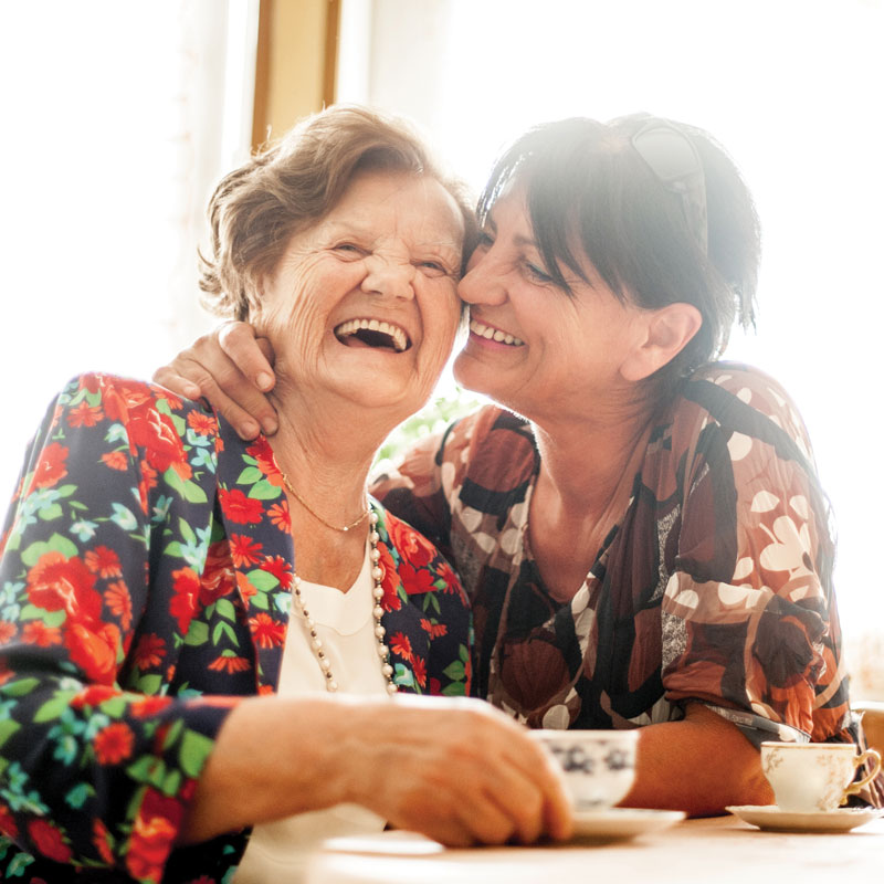 Senior woman smiling with adult child