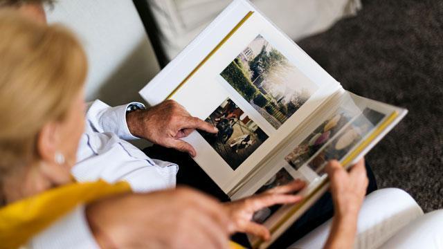 Senior couple looking at photo album